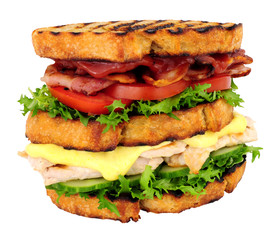 Chicken and bacon double decker sandwich isolated on a white background