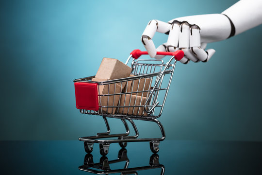 Robot Holding Shopping Cart With Cardboard Boxes