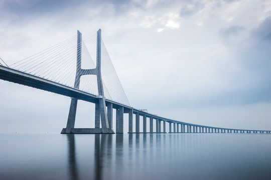 Fototapeta Vasco da Gama Bridge at sunrise in Lisbon, Portugal. he longest bridge in Europe