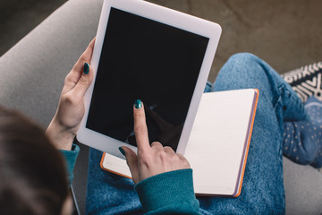 cropped image of girl using tablet