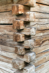 Wood corner of a old building with dovetail joints