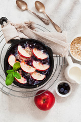 Breakfast baked oatmeal with apples, blueberries and chia seeds, from above