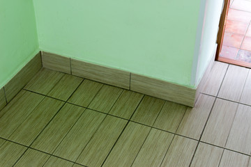 The floor tiles in the hallway of the building