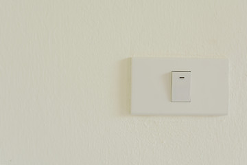 White light switch on wall turn on or turn off the lights, copy space