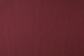 close up view of burgundy woven fabric texture