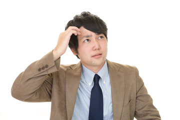 不安そうな表情のビジネスマン