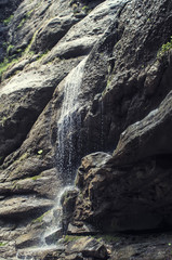 Obraz premium Wonderful landscape Small mountain waterfall rushing over the rocks