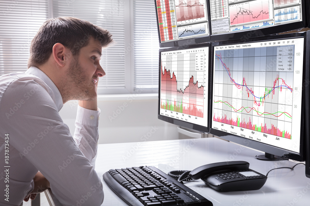 Aufkleber Sad Male Operator Looking At Graphs On Multiple Computer Screen