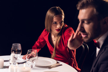 girlfriend slaping her boyfriend during romantic date in restaurant