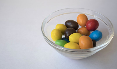 Colorful candies on white background