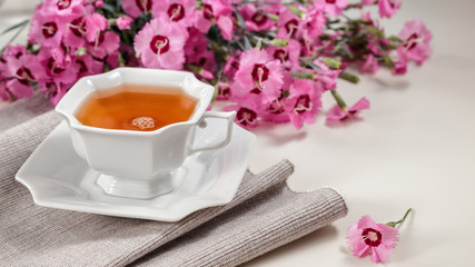 Obraz na płótnie Canvas Cup of green tea on white table