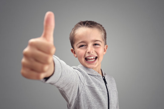 Boy with thumbs up agreeing