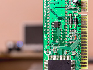 computer board green on a blurry background with a computer