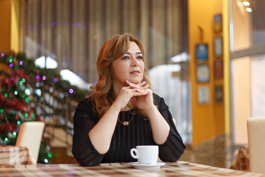 Woman with cup of coffee