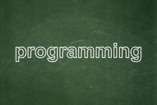 Software concept: text Programming on Green chalkboard background
