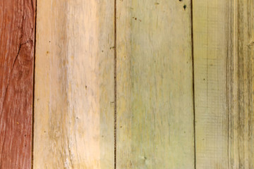 Textured surface of wooden boards painted in different colors