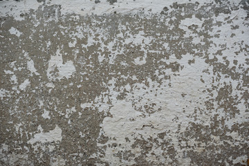 Wall fragment with scratches and cracks
