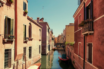 Venice, Italy - August 14, 2017: Venice canal with boats and classic buildings.