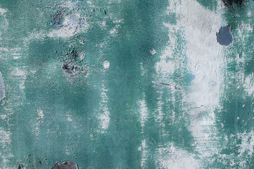 Old weathered painted grunge metal sheet surface with faded and cracked paint closeup as background