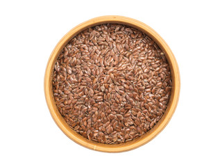 Linseed or flax seed in a wooden bowl seen from above isolated om white background