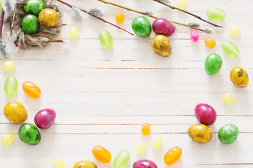 Fototapeta na wymiar Easter eggs on white wooden backgound