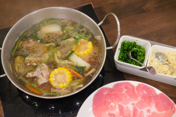 Cooking food by put a flesh beef pork and vegetable