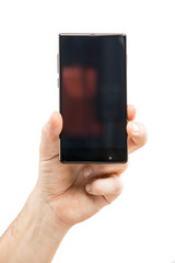 Hand holding black bezelless smartphone with blank screen on white background