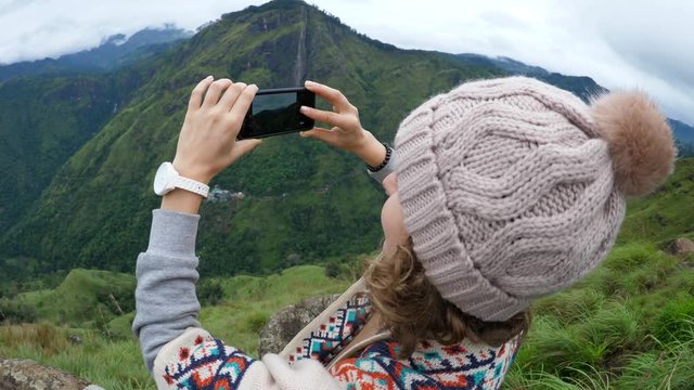 Female Hiker Taking Picture With Smartphone On Mountain Top. 4K.