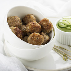 hearty meatballs served in a small bowl.
