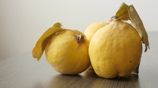 Cydonium malum on the table slow tilt footage - Quince fruit pieces close-up