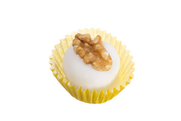 Homemade white chocolate truffle. Known as Camafeu in Brazil. Overhead of candy ball in white background.