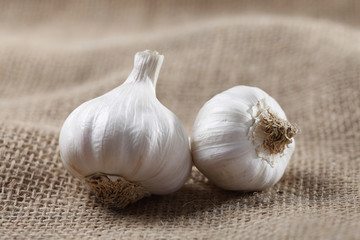 garlic on a jute mat .