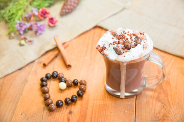 Obraz na płótnie Canvas Hot chocolate with cream and cinnamon