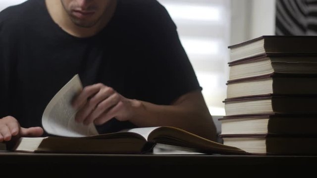 Timelapse of man reads book in the library