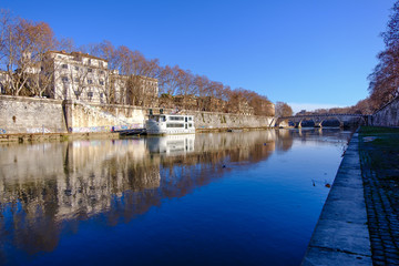 Travel photography - walking along the banks of the Tiber (Rome, Italy, Europe).