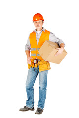 male builder or manual worker in helmet holding and moving  cardboard box on white background.