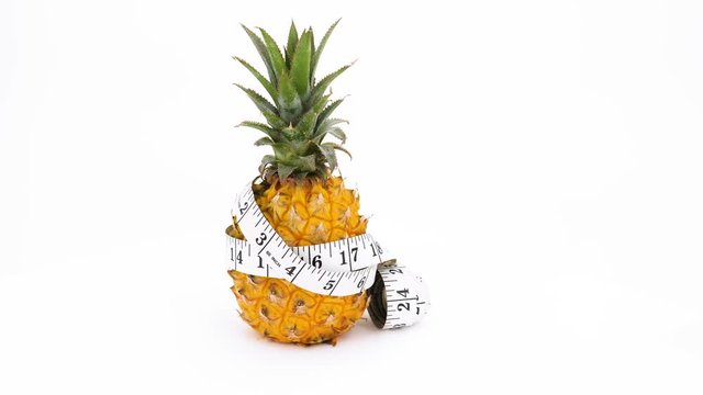 Pineapple rotating on white background, (loopable video) 4K 