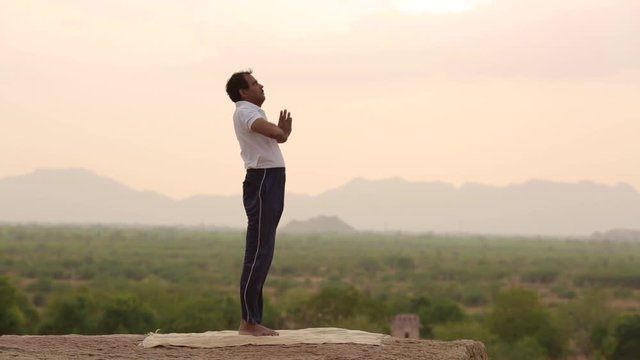 Young Man In Yoga Pose
