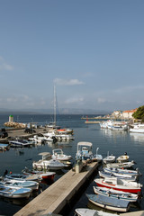 Fototapeta na wymiar Port in Bol town on the island of Brac with shore side boats