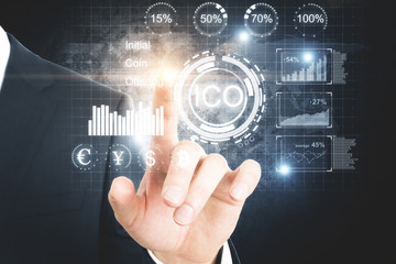 Businessman pointing at ico hologram