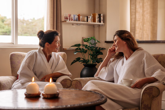 Female friends chatting while waiting for spa