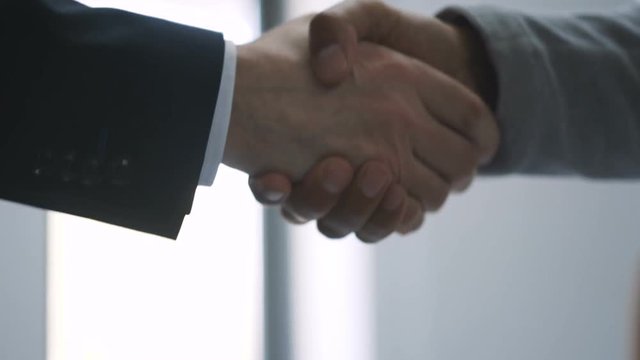 man shakes hands with his colleagues conference meeting communication successful talking team partnership, people corporate desk woman business computer couple sitting work suit Slow motion