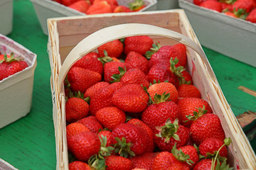 Close up strawberry in wooden crate on market