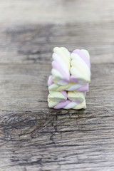 marshmallow cubes on wooden background