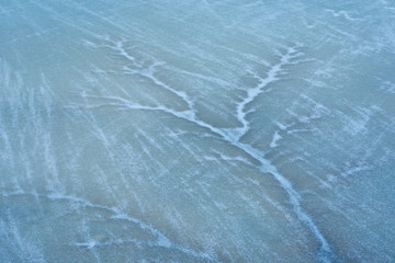 crack in the ice on the lake surface