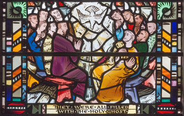 LONDON, GREAT BRITAIN - SEPTEMBER 16, 2017: The scene of Pentecost on the stained glass in church St Etheldreda by Charles Blakeman (1953 - 1953).