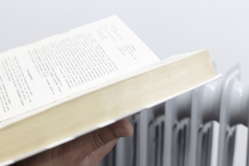 a man heating and reading book