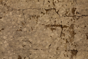Old mottled brown cracked stone wall distressed grunge background