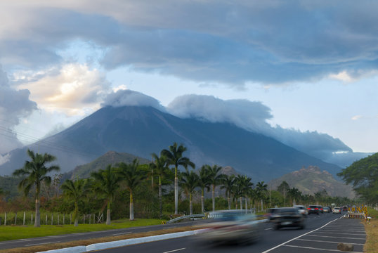 Sunset on highway with view of volcanoes Fuego y Acatenango in Palin, Guatemala.
