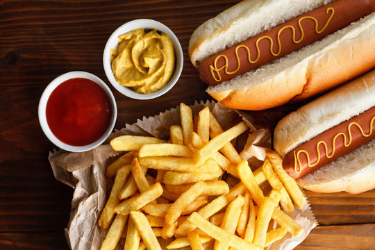 hot dog and french fries on a wooden table